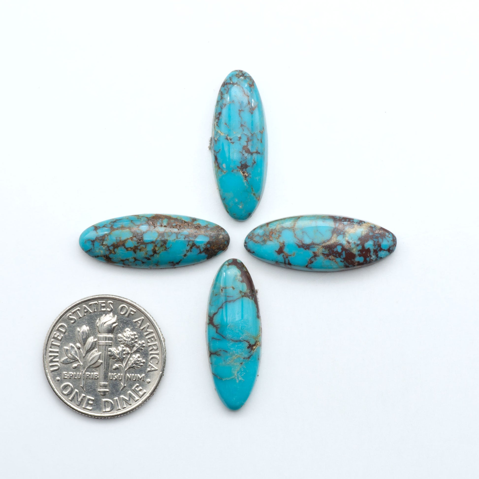 Hubei Cloud Mountain Turquoise cabochons, blue and green color with distinctive matrix, polished stones on a white background with a US dime for scale