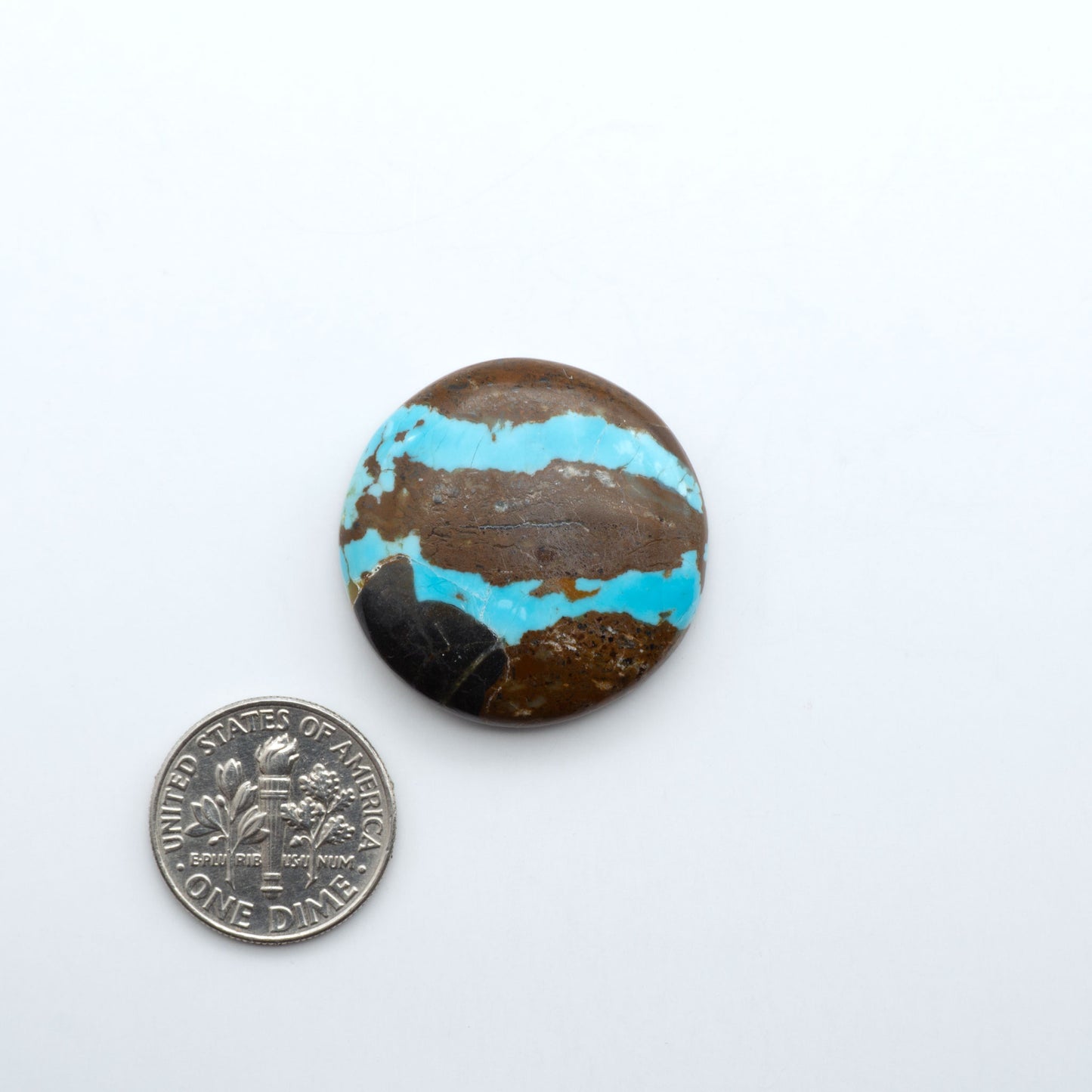 Number 8 Turquoise cabochons, blue and green color with brown matrix, polished stones on a white background, with a US dime for scale