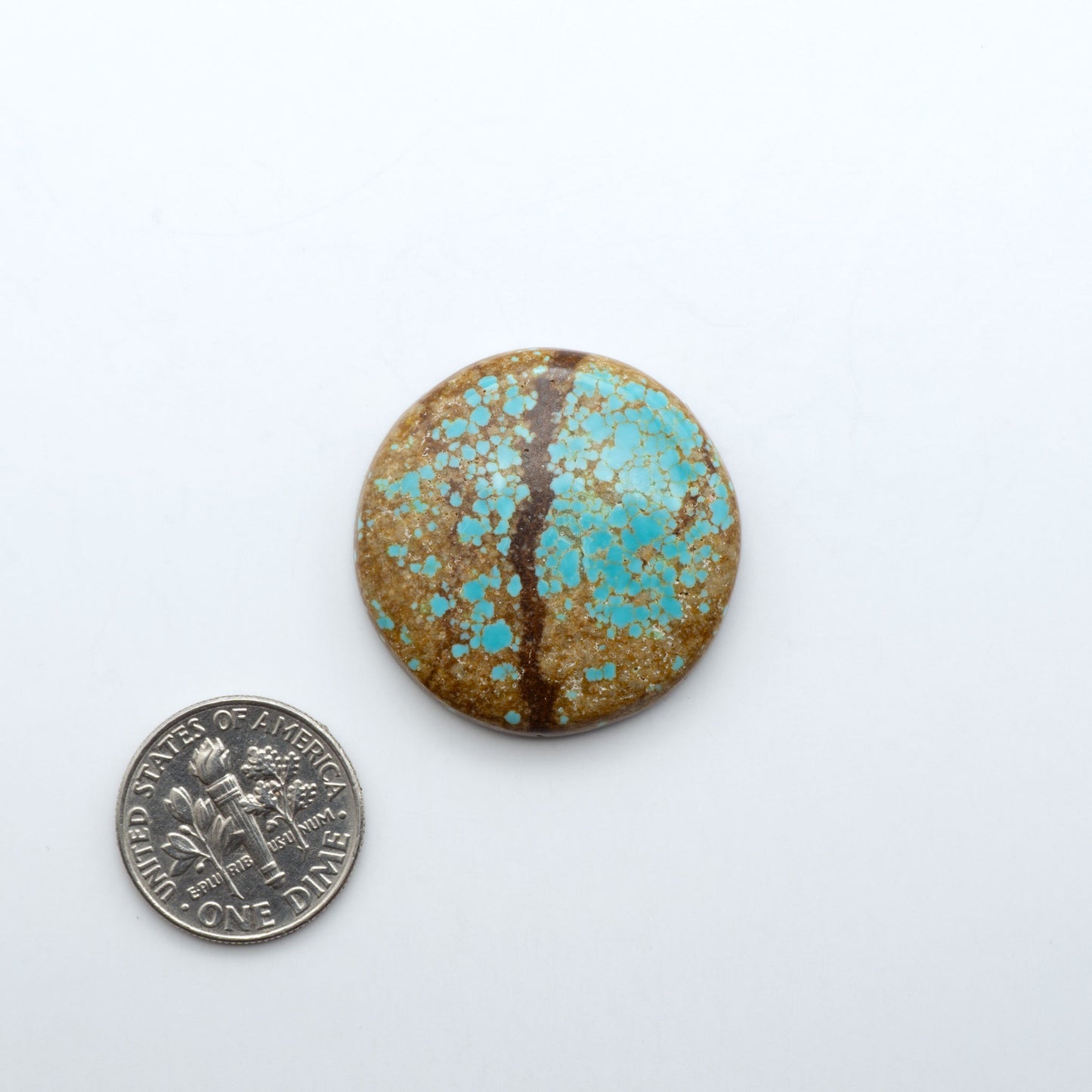 Number 8 Turquoise cabochons, blue and green color with brown matrix, polished stones on a white background, with a US dime for scale