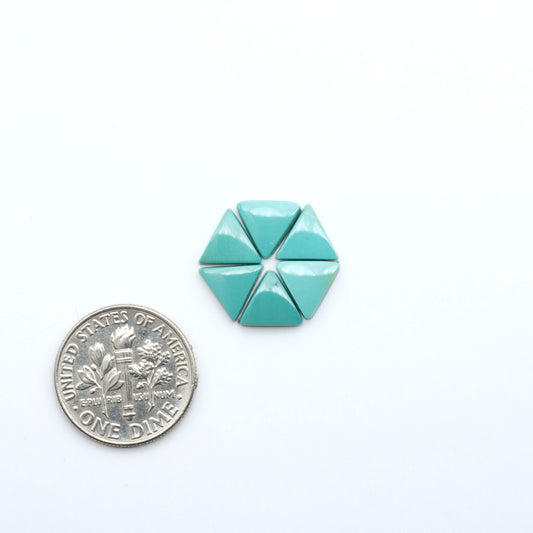 Hubei Cloud Mountain Turquoise cabochons, blue and green color with black matrix, polished stones on a white background, with a US dime for scale