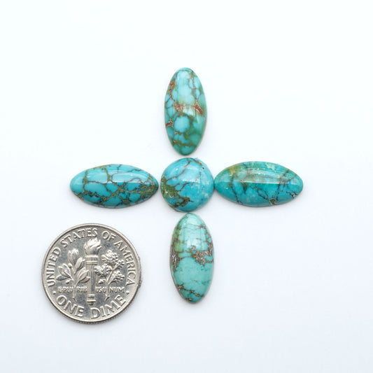 Hubei Cloud Mountain Turquoise cabochons, blue and green color with black matrix, polished stones on a white background, with a US dime for scale