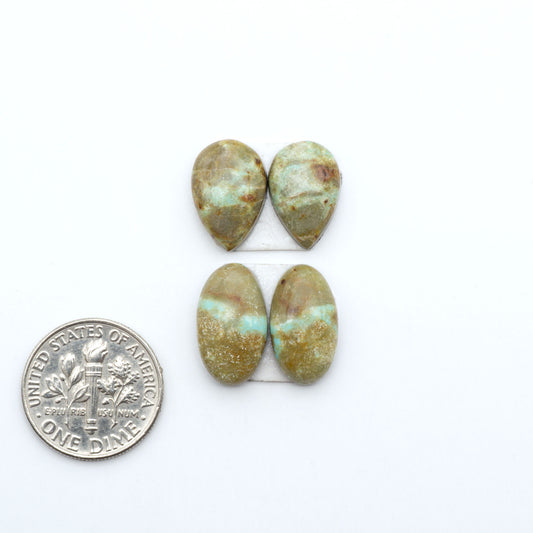 Number 8 Turquoise cabochons, blue and green color with brown matrix, polished stones on a white background, with a US dime for scale