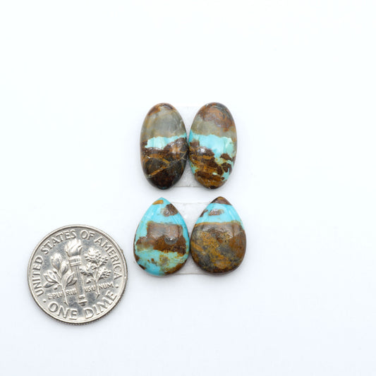 Number 8 Turquoise cabochons, blue and green color with brown matrix, polished stones on a white background, with a US dime for scale