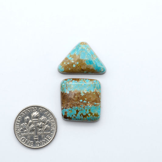 Number 8 Turquoise cabochons, blue and green color with brown matrix, polished stones on a white background, with a US dime for scale